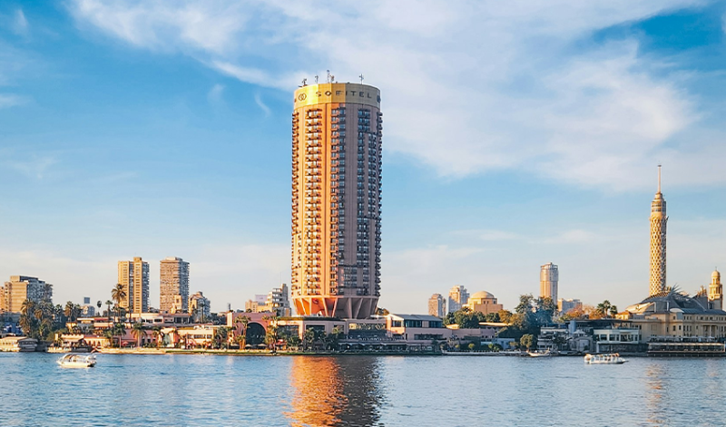 Family exploring the Grand Egyptian Museum in Giza including interactive children exhibits
